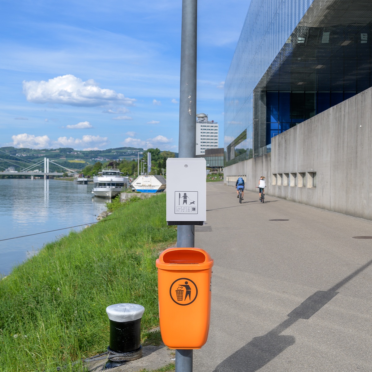 Canine dog bag dispenser in urban environment